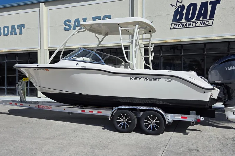 Slide: The Image of 2020 Key West 239 DFS boat on trailer at dealership, side view. - 3