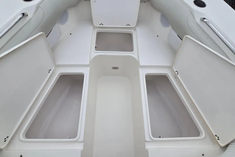 Slide: The Image of 2020 Key West 239 DFS boat interior with open storage compartments. - 6