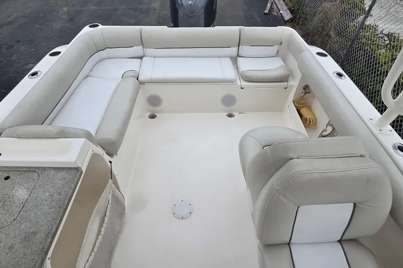 Slide: The Image of 2020 Key West 239 DFS boat interior with white seating and spacious layout. - 9