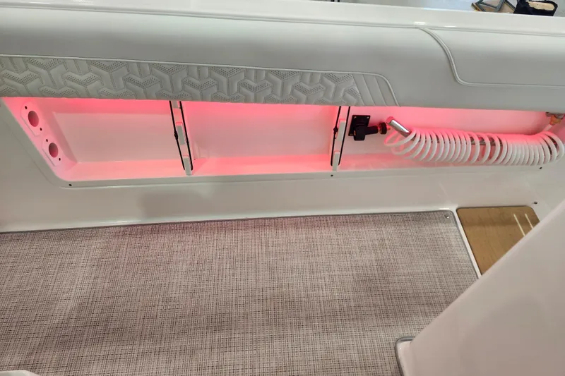 Slide: The Image of Interior view of 2026 Regal 38 SAV boat with pink LED lighting. - 16