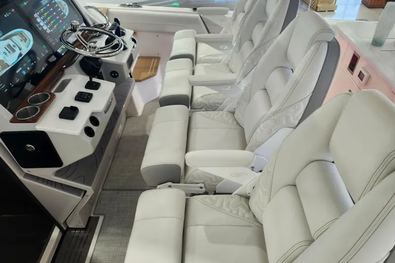 Slide: The Image of Luxurious interior of 2026 Regal 38 SAV boat with plush seating and advanced controls. - 19