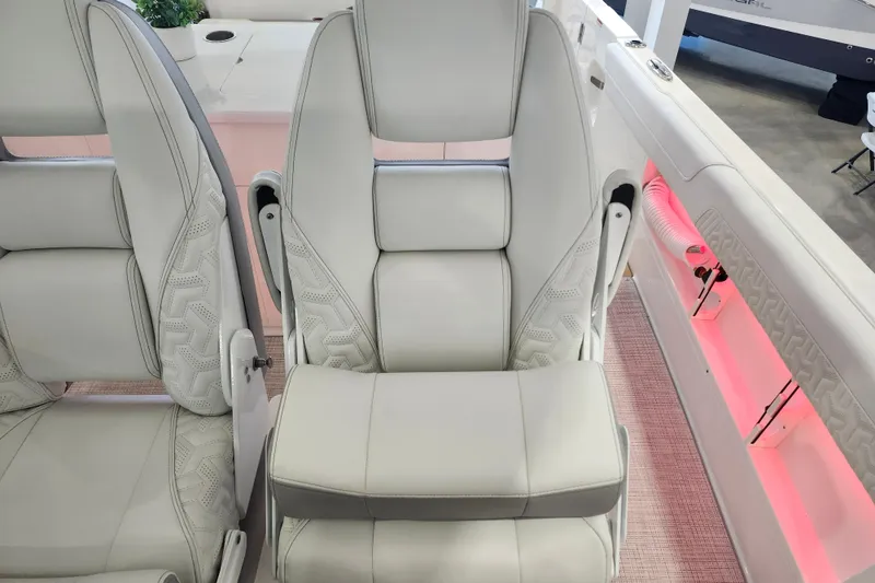 Slide: The Image of Luxurious seating on 2026 Regal 38 SAV boat with elegant white upholstery and ambient lighting. - 21