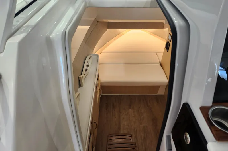 Slide: The Image of Interior cabin of 2026 Regal 38 SAV boat with modern seating and wood flooring. - 24
