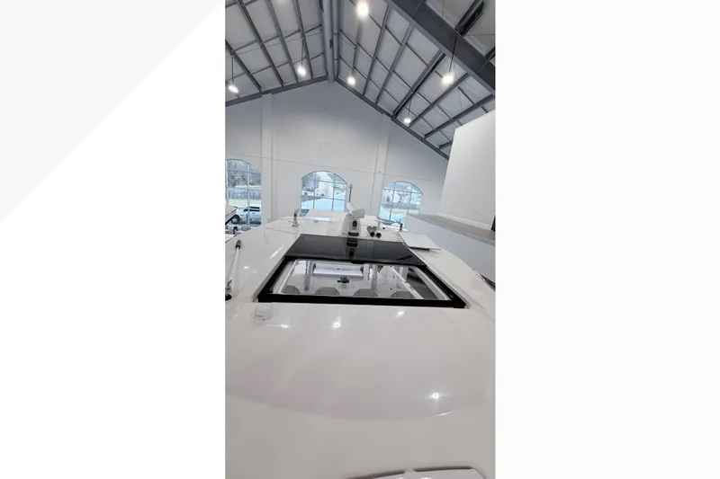 Slide: The Image of Triple Yamaha 350 V6 engines on a 2026 Regal 38 SAV boat in a showroom. - 3