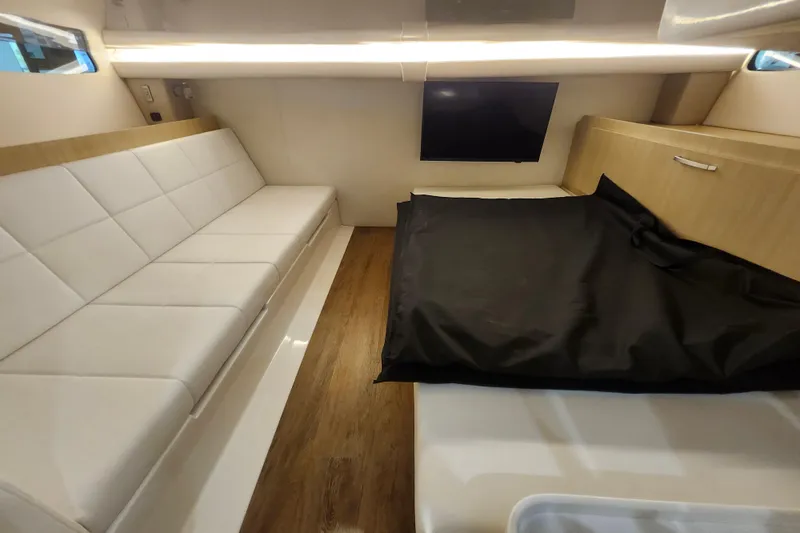 Slide: The Image of Luxurious interior of 2026 Regal 38 SAV yacht with modern seating and TV. - 32