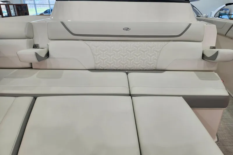 Slide: The Image of Luxurious seating on 2026 Regal 38 SAV boat, featuring elegant white upholstery and cup holders. - 35