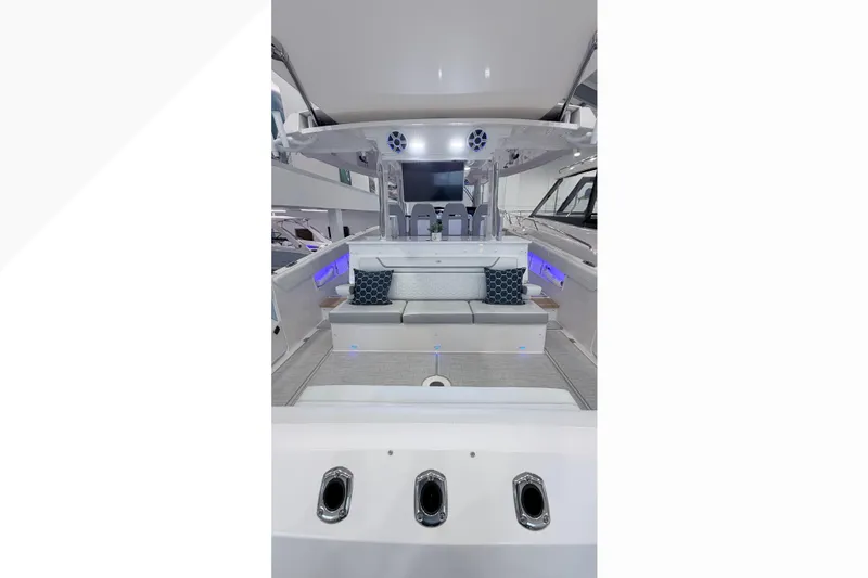 Slide: The Image of 2026 Regal 38 SAV boat interior with sink, grill, and potted plant. - 8