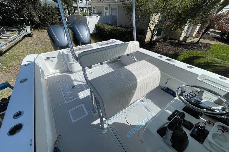 Slide: The Image of 2008 Contender 27 Tournament boat with Yamaha 300 engines, featuring livewell compartments. - 11