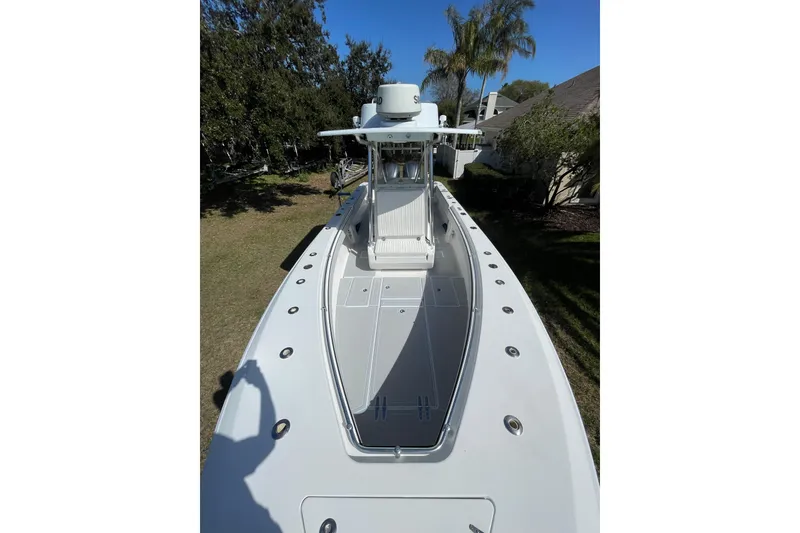 Slide: The Image of 2008 Contender 27 Tournament boat helm with Simrad electronics and steering wheel. - 16