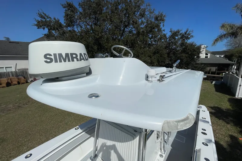 Slide: The Image of Steering console of 2008 Contender 27 Tournament boat with palm trees in background. - 17