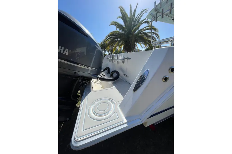 Slide: The Image of 2008 Contender 27 Tournament boat interior with dual engines and steering console. - 9