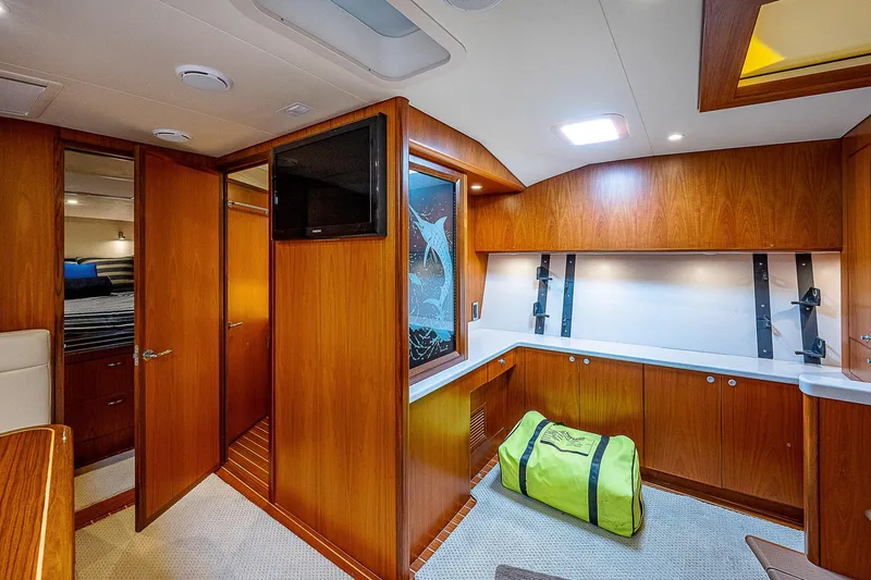 Slide: The Image of Interior of 2012 Cabo 44 HTX yacht with wood paneling and modern amenities. - 10