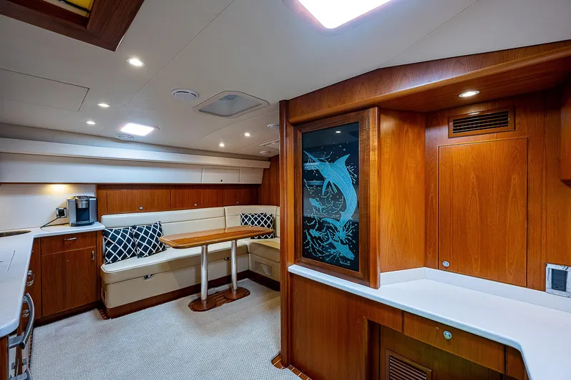 Slide: The Image of Luxurious interior of 2012 Cabo 44 HTX yacht with wood finish and seating area. - 11