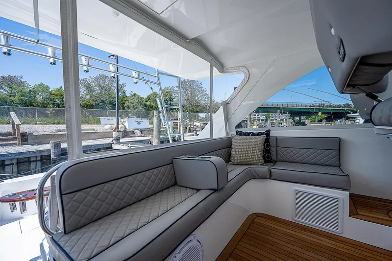 Slide: The Image of Luxurious interior of 2012 Cabo 44 HTX yacht with elegant seating and wood flooring. - 25