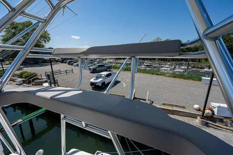 Slide: The Image of View from Cabo 44 HTX 2012 boat, overlooking marina and parked cars on a sunny day. - 33