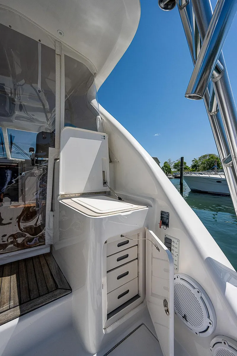 Slide: The Image of 2012 Cabo 44 HTX yacht interior with storage drawers and sleek design. - 41