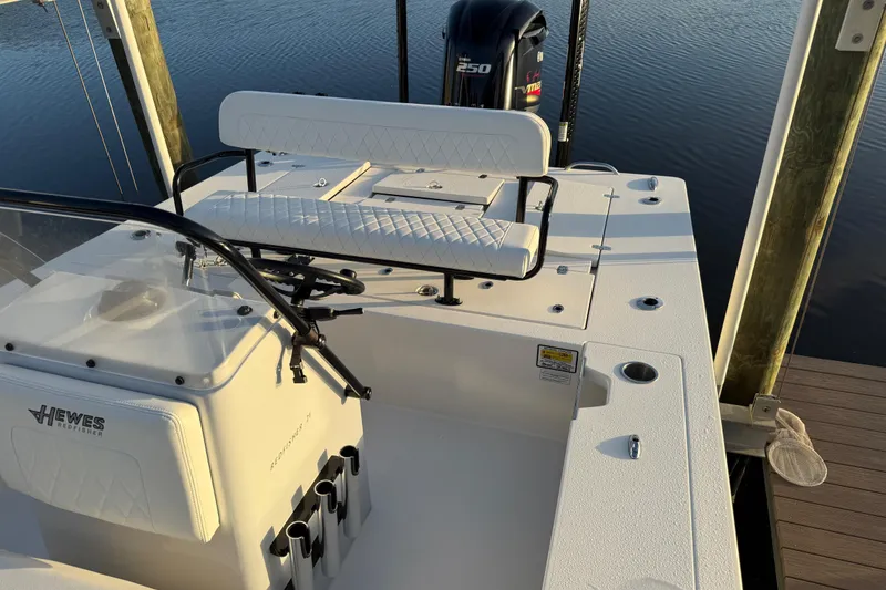 Slide: The Image of 2021 Hewes Redfisher 21 boat interior with seating and Yamaha 250 engine. - 7