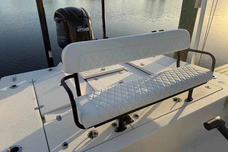 Slide: The Image of 2021 Hewes Redfisher 21 boat with Yamaha 250 engine, featuring white cushioned seating. - 8