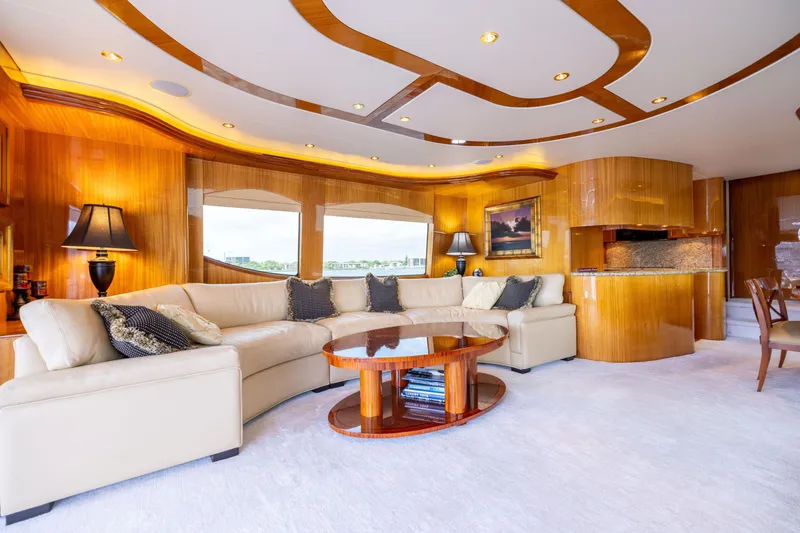 Slide: The Image of Luxurious 2005 Hatteras 80 Motor Yacht deck with elegant seating and ocean view. - 16