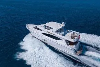Slide: The Image of 2005 Hatteras 80 Motor Yacht on open sea, featuring sleek design and luxury amenities. - 2