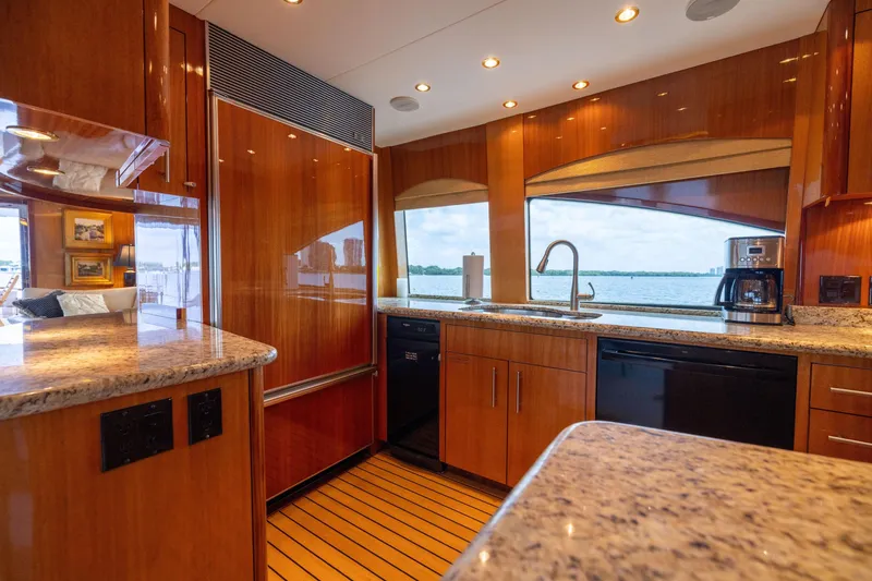 Slide: The Image of Luxurious interior of 2005 Hatteras 80 Motor Yacht with elegant wood finishes and spacious seating. - 20