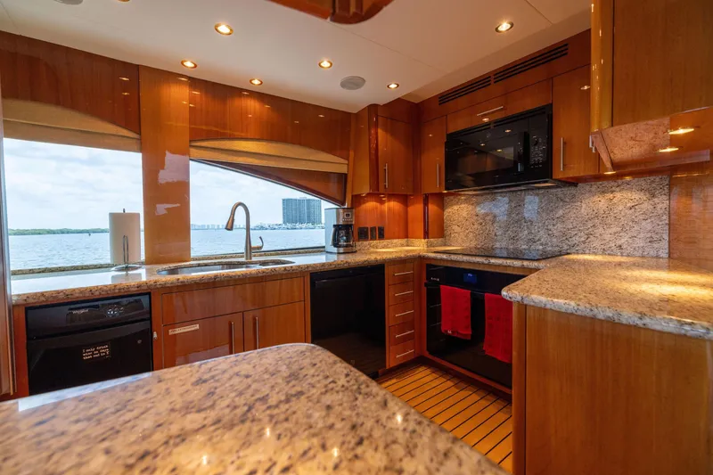 Slide: The Image of Luxurious interior of 2005 Hatteras 80 Motor Yacht with elegant wood finishes and modern furnishings. - 21