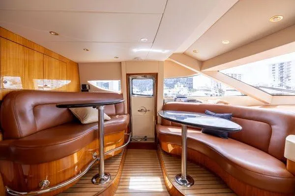 Slide: The Image of Luxurious kitchen interior of 2005 Hatteras 80 Motor Yacht with wood cabinetry and ocean view. - 24