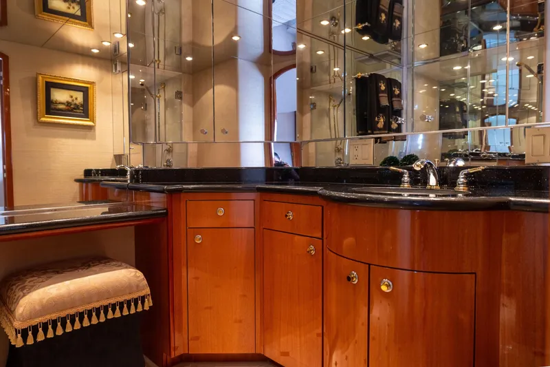 Slide: The Image of Luxurious bedroom interior of 2005 Hatteras 80 Motor Yacht with elegant wood finishes. - 33