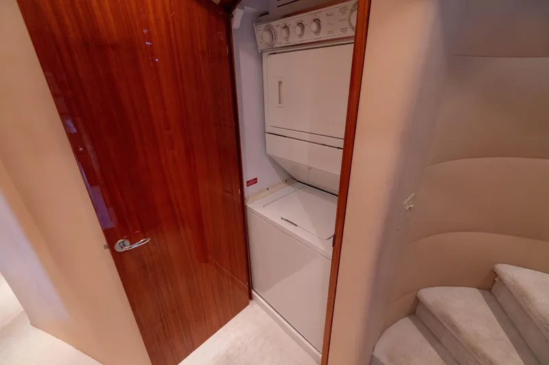 Slide: The Image of Luxurious bathroom interior on 2005 Hatteras 80 Motor Yacht with elegant wood cabinetry. - 36