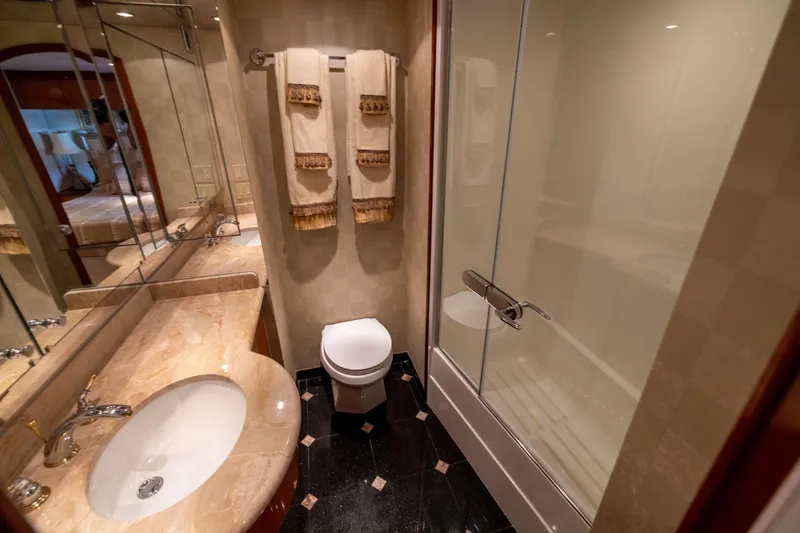 Slide: The Image of Luxurious bedroom interior of 2005 Hatteras 80 Motor Yacht with elegant wood finishes. - 41