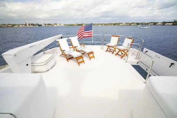 Slide: The Image of Helm of 2005 Hatteras 80 Motor Yacht with advanced navigation controls and displays. - 54
