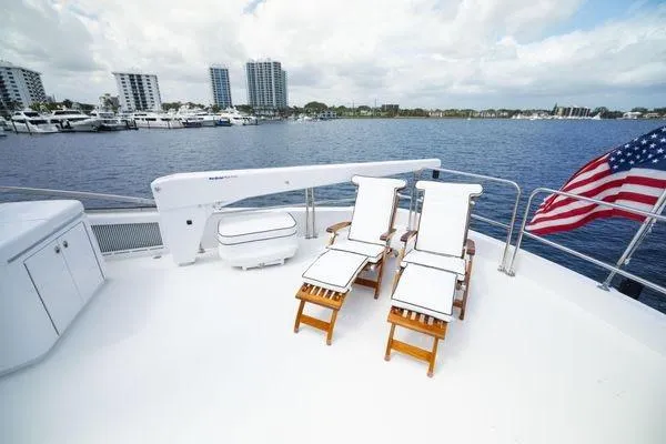 Slide: The Image of Luxurious interior of 2005 Hatteras 80 Motor Yacht with elegant seating and panoramic windows. - 56