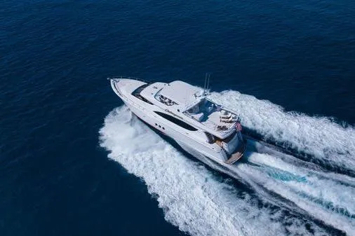 Slide: The Image of Luxurious 2005 Hatteras 80 Motor Yacht deck with outdoor grill and seating area. - 58