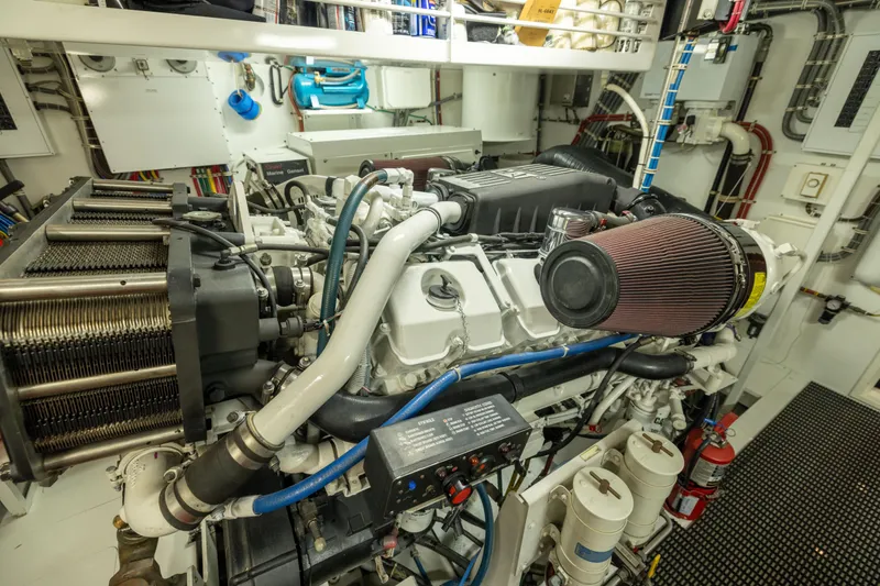 Slide: The Image of Engine room of 2005 Hatteras 80 Motor Yacht, showcasing detailed machinery and components. - 65