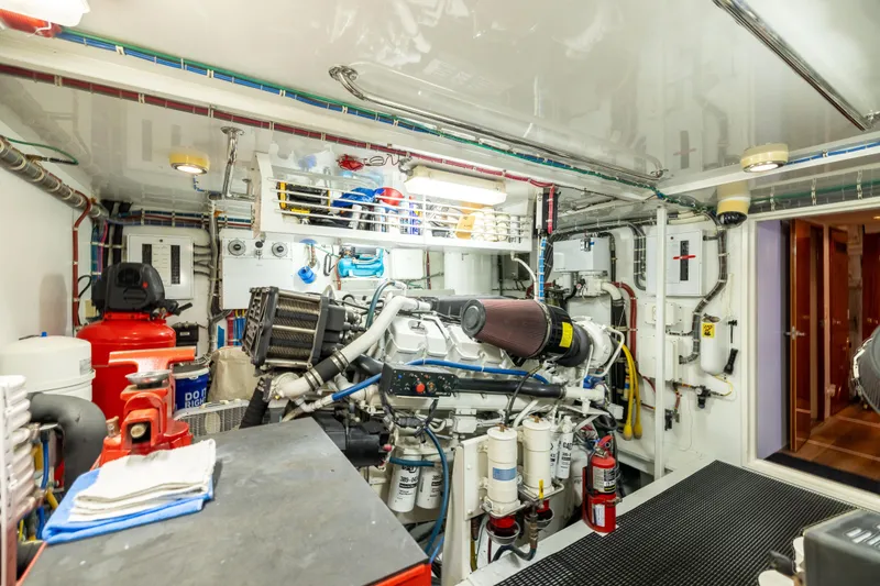 Slide: The Image of Engine room of 2005 Hatteras 80 Motor Yacht, showcasing machinery and equipment. - 68