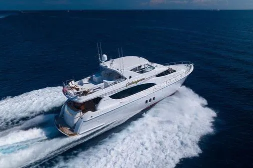 Slide: The Image of 2005 Hatteras 80 Motor Yacht cruising on open ocean waters. - 8
