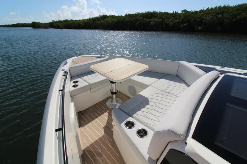 Slide: The Image of Luxurious seating area on the 2025 Saxdor 400 GTS boat, featuring elegant design and water views. - 11