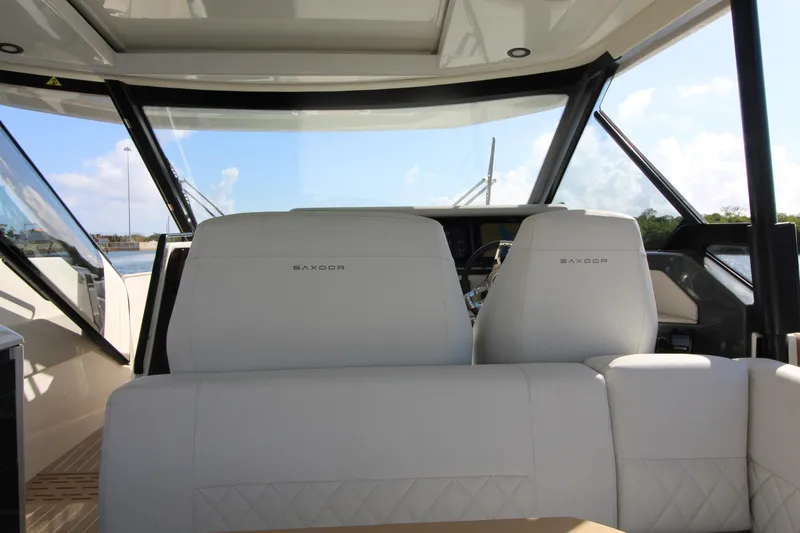 Slide: The Image of Interior view of 2025 Saxdor 400 GTS boat with luxurious seating. - 17