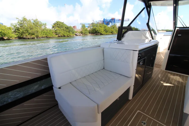 Slide: The Image of 2025 Saxdor 400 GTS boat interior with white seating and sleek design. - 18
