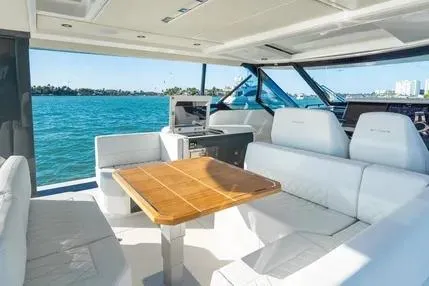 Slide: The Image of 2025 Saxdor 400 GTS luxury boat interior with spacious seating on a sunny day. - 2