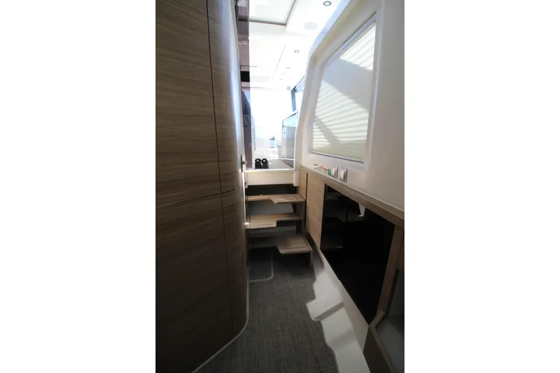 Slide: The Image of Interior of 2025 Saxdor 400 GTS yacht, featuring modern wood paneling and sleek design. - 21