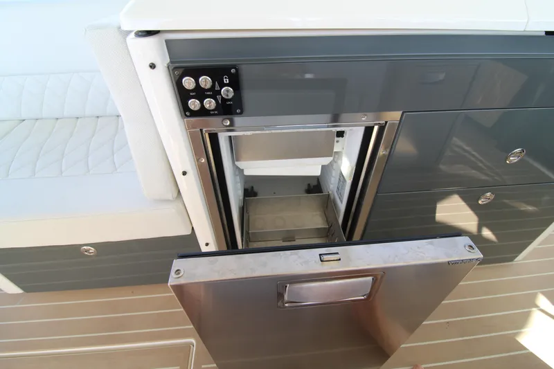 Slide: The Image of Open stainless steel drawer on Saxdor 400 GTS 2025 boat, showcasing interior storage. - 23