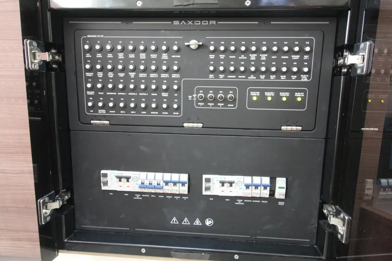 Slide: The Image of Control panel of 2025 Saxdor 400 GTS boat, featuring switches and circuit breakers. - 29