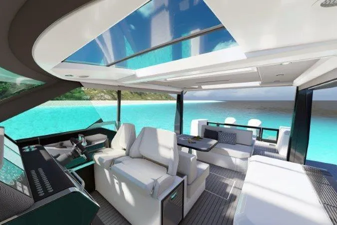 Slide: The Image of 2025 Saxdor 400 GTS luxury boat interior with seating and table on a sunny day. - 3