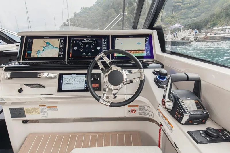 Slide: The Image of 2025 Saxdor 400 GTS luxury boat interior with modern seating and scenic water view. - 4