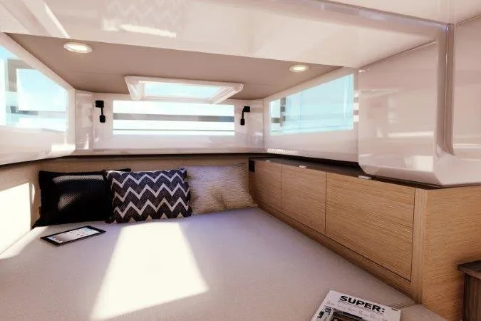 Slide: The Image of Luxurious interior of 2025 Saxdor 400 GTS boat with white seating and sleek design. - 6