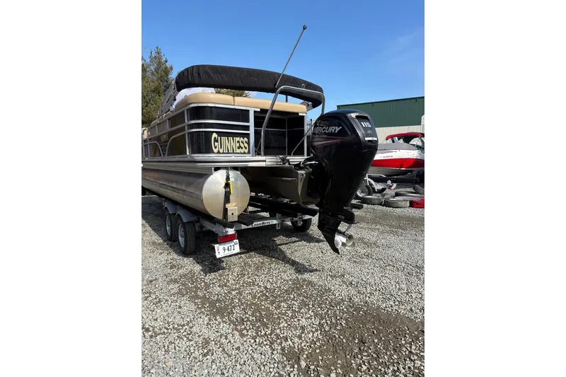 Slide: The Image of 2018 Lowe SS 210 pontoon boat with Mercury engine on trailer. - 5