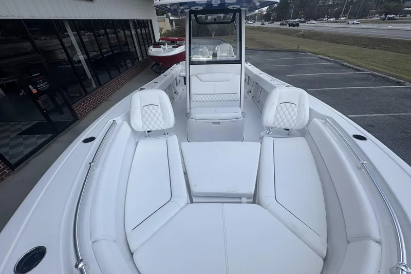Slide: The Image of 2026 Sportsman Heritage 261 Center Console boat with spacious seating and modern design. - 13