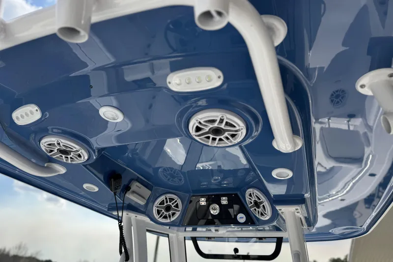 Slide: The Image of 2026 Sportsman Heritage 261 Center Console boat interior with speakers and controls. - 30