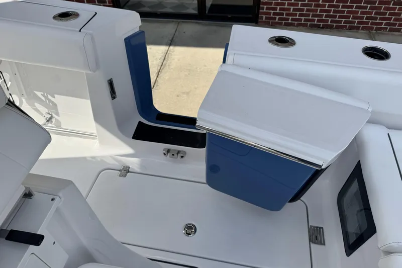 Slide: The Image of 2026 Sportsman Heritage 261 Center Console boat interior with storage compartments. - 32
